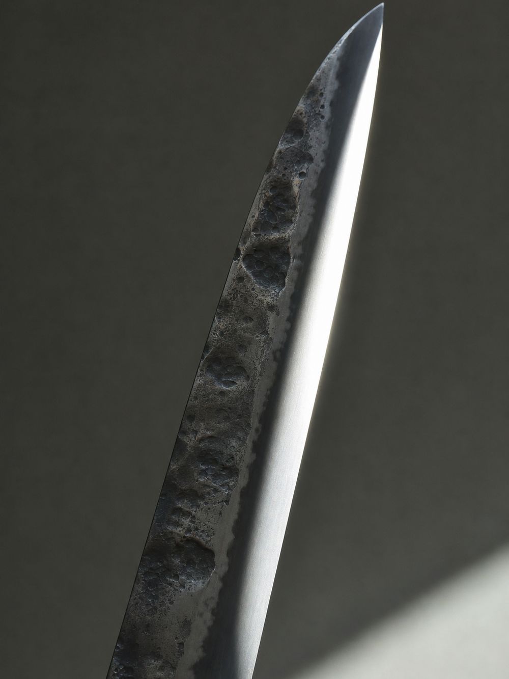 The polished bevel of a hand-forged blade